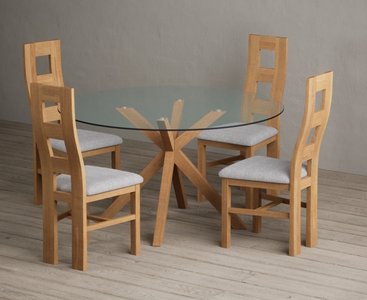 View Lakelyn 140cm round solid oak and glass dining table with 4 light grey natural chairs View Lakelyn 140cm round solid oak and glass dining table with 4 light grey natural chairs