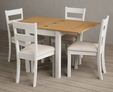 View Extending hadleigh oak and signal white painted dining table with 2 blue kendal chairs View Extending hadleigh oak and signal white painted dining table with 2 blue kendal chairs