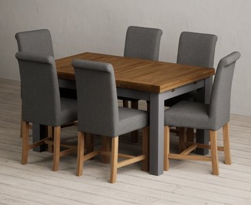 View Extending buxton 140cm oak and charcoal grey painted dining table with 8 grey scroll back chairs View Extending buxton 140cm oak and charcoal grey painted dining table with 8 grey scroll back chairs