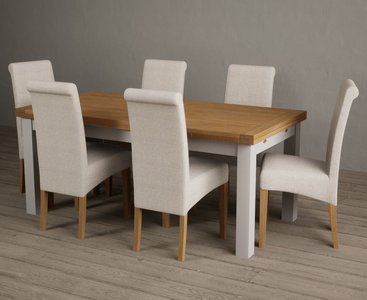View Extending buxton 180cm oak and soft white painted dining table with 12 natural scroll back chairs View Extending buxton 180cm oak and soft white painted dining table with 12 natural scroll back chairs