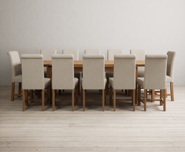 View Extending buxton 180cm solid oak dining table with 12 brown scroll back chairs View Extending buxton 180cm solid oak dining table with 12 brown scroll back chairs