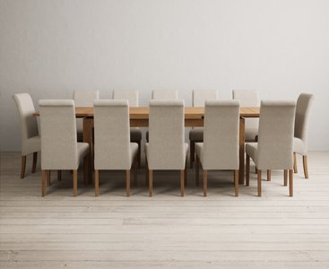 View Extending buxton 180cm solid oak dining table with 12 brown scroll back chairs View Extending buxton 180cm solid oak dining table with 12 brown scroll back chairs