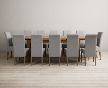 View Extending buxton 180cm solid oak dining table with 12 brown scroll back chairs View Extending buxton 180cm solid oak dining table with 12 brown scroll back chairs