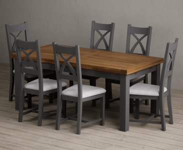 View Extending buxton 180cm oak and charcoal grey painted dining table with 12 light grey painted chairs View Extending buxton 180cm oak and charcoal grey painted dining table with 12 light grey painted chairs