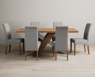 View Michigan 180cm solid oak and metal industrial dining table with 8 brown scroll back chairs View Michigan 180cm solid oak and metal industrial dining table with 8 brown scroll back chairs
