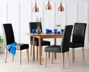 View Extending york 70cm solid oak drop leaf dining table with 2 black olivia chairs View Extending york 70cm solid oak drop leaf dining table with 2 black olivia chairs