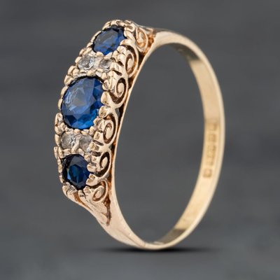 Second Hand Vintage 9ct Yellow Gold Synthetic Sapphire & White Spinel Seven Stone Ring