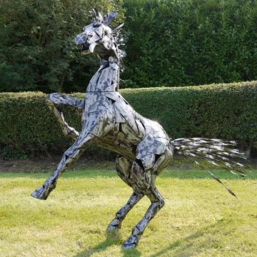 Silver metal rearing horse statue