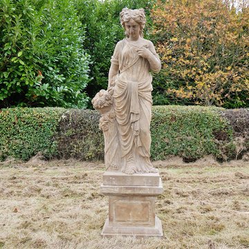 Statue - hand carved stone lady - with flowers