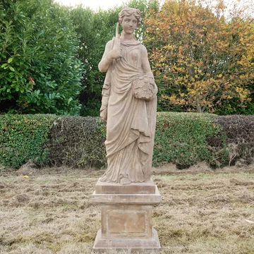 Statue - hand carved stone lady - with sickle