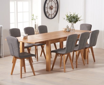 Extending thetford 180cm solid oak dining table with 6 grey ruben chairs