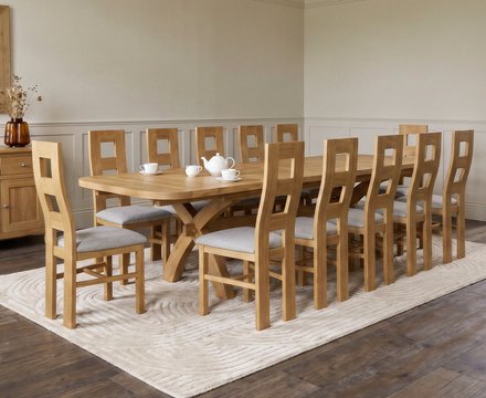 Extending olympia 180cm solid oak dining table with 12 light grey natural chairs