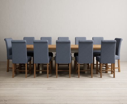 Extending olympia 180cm oak and cream painted dining table with 12 blue braced chairs