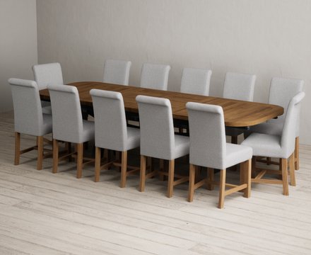 Extending olympia 180cm oak and dark blue dining table with 12 grey braced chairs