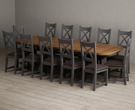 Extending olympia 180cm oak and charcoal grey dining table with 12 brown painted chairs