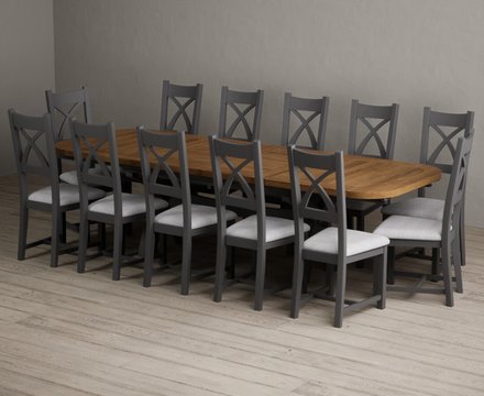 Extending olympia 180cm oak and charcoal grey dining table with 12 light grey painted chairs