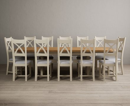 Extending olympia 180cm oak and cream painted dining table with 12 light grey painted chairs