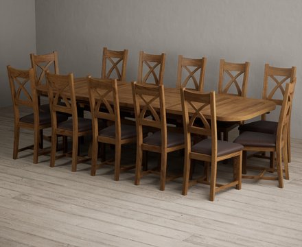 Extending olympia 180cm rustic solid oak dining table with 12 brown rustic solid oak chairs