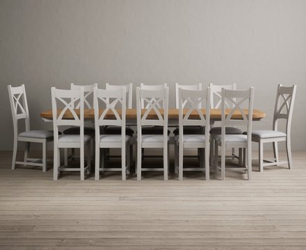 Extending olympia 180cm oak and soft white painted dining table with 12 light grey painted chairs