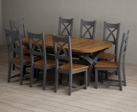 Extending olympia 180cm oak and charcoal grey dining table with 8 rustic oak painted chairs