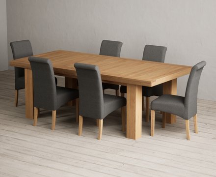 Extending callington 230cm oak dining table with 12 charcoal grey scroll back chairs