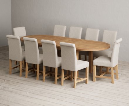 Extending caversham oak oval dining table with 10 natural braced chairs