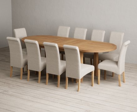 Extending caversham oak oval dining table with 10 natural scroll back chairs