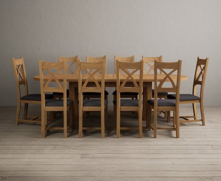 Extending caversham oak oval dining table with 10 charcoal grey natural solid oak chairs