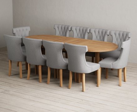 Extending caversham oak oval dining table with 10 grey clara chairs