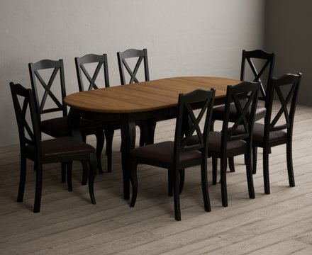 Extending chateau noir 140cm oak and black painted oval dining table with 8 brown chateau noir chairs