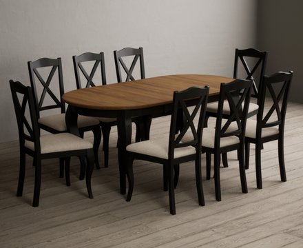 Extending chateau noir 140cm oak and black painted oval dining table with 8 linen chateau noir chairs