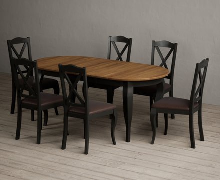 Extending chateau noir 140cm oak and black painted oval dining table with 6 brown chateau noir chairs