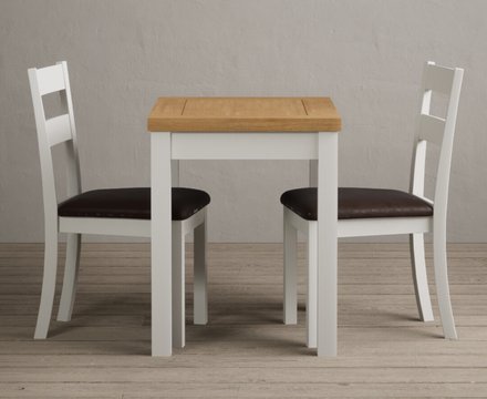 Extending hadleigh oak and signal white painted dining table with 2 brown kendal chairs