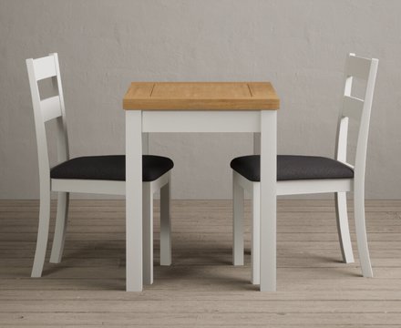 Extending hadleigh oak and signal white painted dining table with 2 charcoal grey kendal chairs