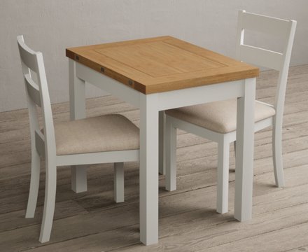 Extending hadleigh oak and signal white painted dining table with 6 linen kendal chairs