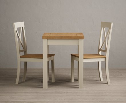 Extending hadleigh oak and cream painted dining table with 2 oak hertford chairs