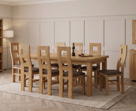 Extending buxton 140cm solid oak dining table with 8 brown natural chairs