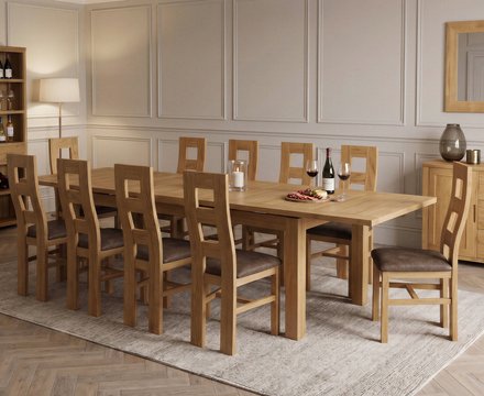 Extending buxton 140cm solid oak dining table with 10 brown natural chairs
