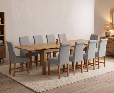 Extending buxton 180cm solid oak dining table with 10 grey braced chairs
