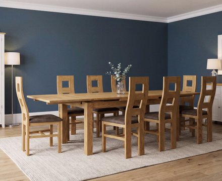 Extending buxton 180cm solid oak dining table with 8 brown natural chairs