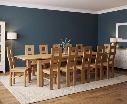 Extending buxton 180cm solid oak dining table with 12 oak natural chairs