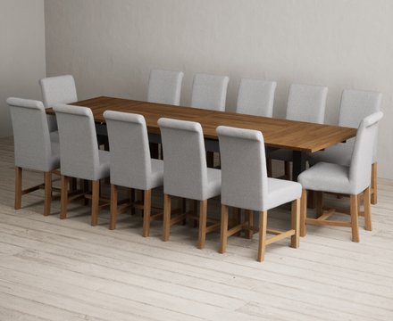 Extending buxton 180cm oak and charcoal grey dining table with 12 grey braced chairs