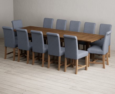 Extending buxton 180cm rustic solid oak dining table with 12 blue braced chairs