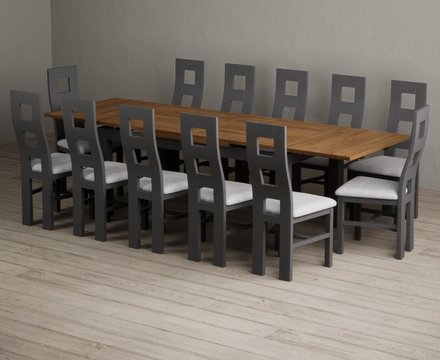 Extending buxton 180cm oak and charcoal grey dining table with 12 light grey painted chairs