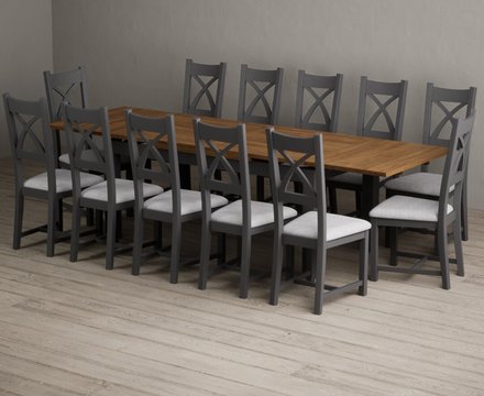 Extending buxton 180cm oak and charcoal grey dining table with 12 light grey painted chairs