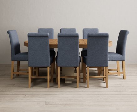 Extending helmsley oak and cream painted pedestal dining table with 8 blue braced chairs
