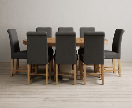 Extending helmsley oak and cream painted pedestal dining table with 8 charcoal grey braced chairs