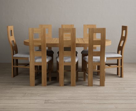 Extending helmsley oak and cream painted pedestal dining table with 8 light grey natural chairs