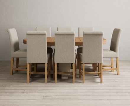 Extending helmsley oak and cream painted pedestal dining table with 8 natural braced chairs