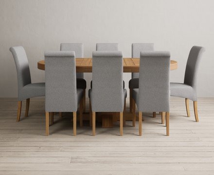 Extending helmsley solid oak pedestal dining table with 8 grey scroll back chairs